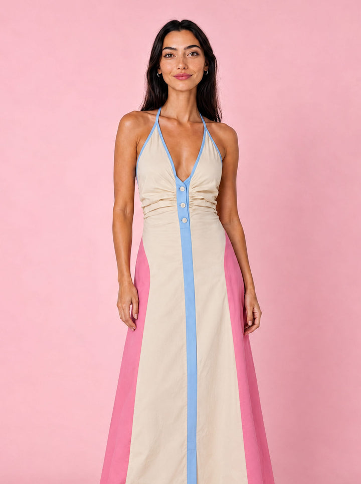 Model wearing the Marnie pink, cream and blue halter neck cotton maxi dress by Boo Pala London